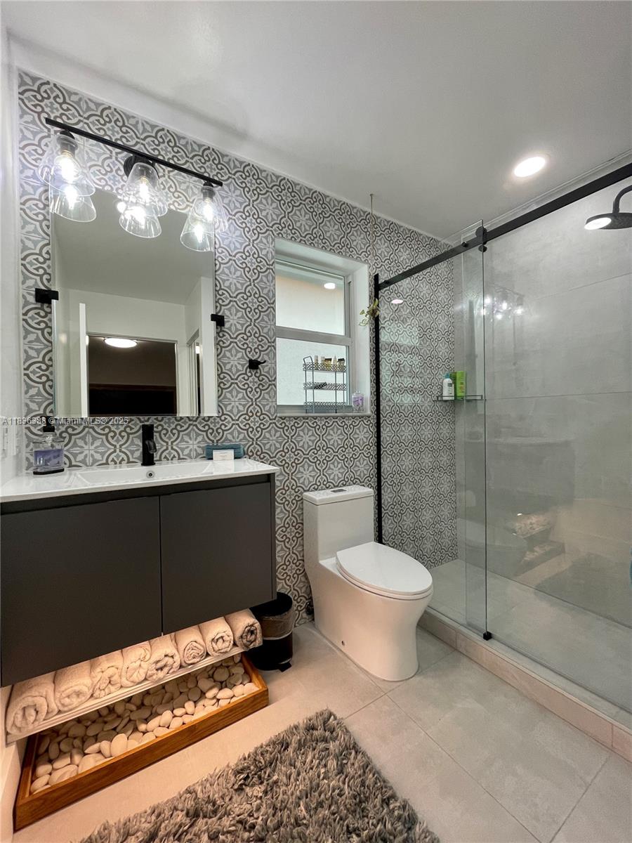 Photo of 1125 Papaya St  (1125), Hollywood, Florida, 33019 - 2rd Bathroom with floating vanity and frameless shower door