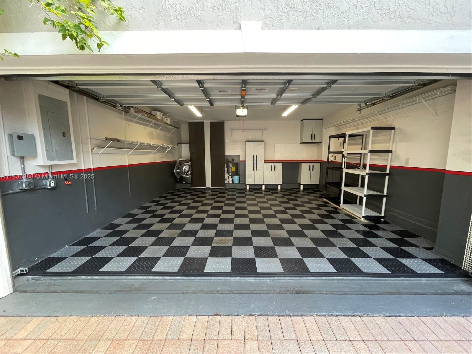 Photo of 1125 Papaya St  (1125), Hollywood, Florida, 33019 - 2 car garage with nice vinyl floors and 220v outlet for electric car charger