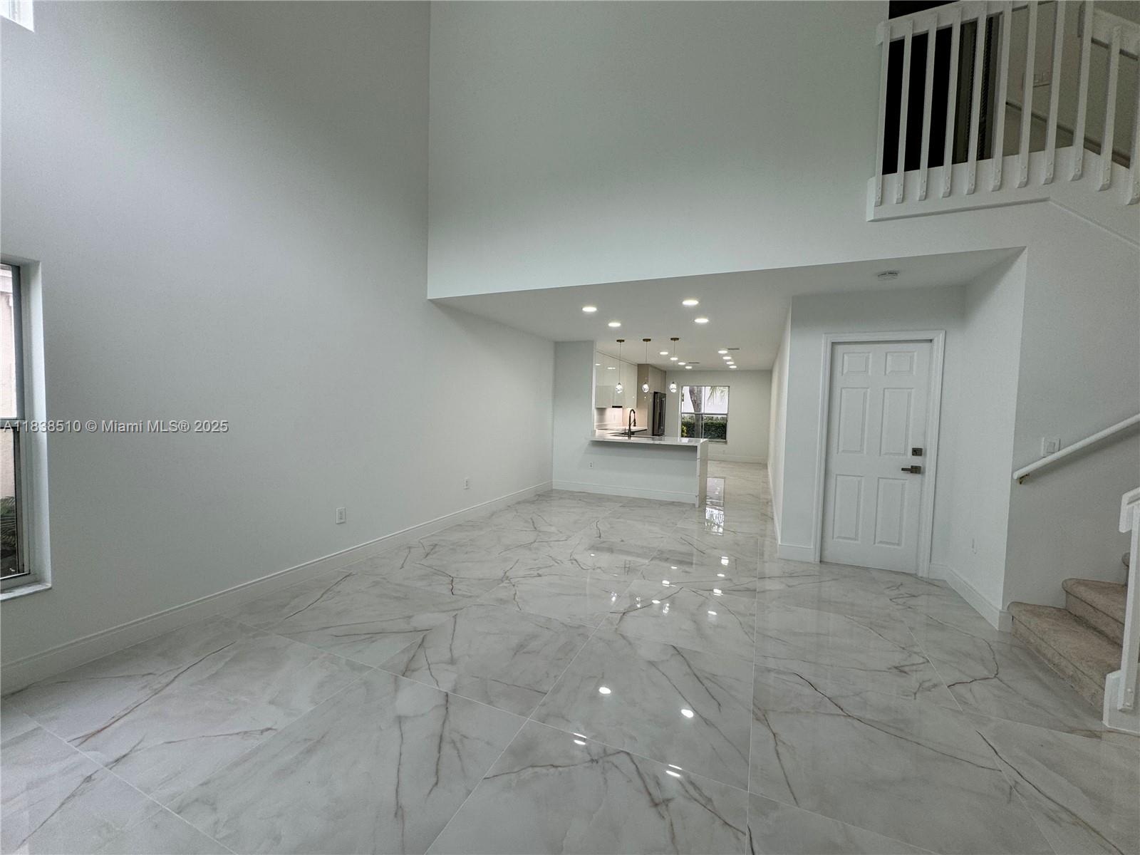 Photo of 1470 Sweetbay Way  (1470), Hollywood, Florida, 33019 - Living area, Dining area, Kitchen with bar seating and additional breakfast/family space
