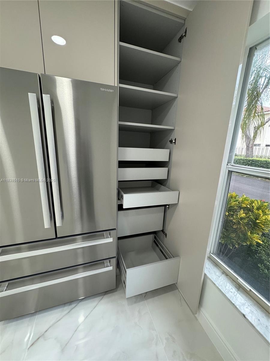 Photo of 1470 Sweetbay Way  (1470), Hollywood, Florida, 33019 - One of two full-height pantry cabinets with pull-out shelves
