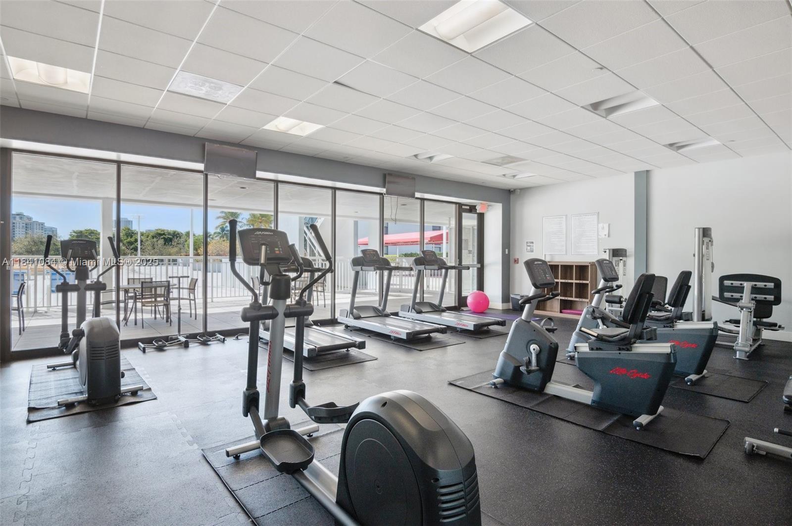 Photo of 3675 Country Club Dr  #2502, Aventura, Florida, 33180 - Gym Overlooking the Pool Area