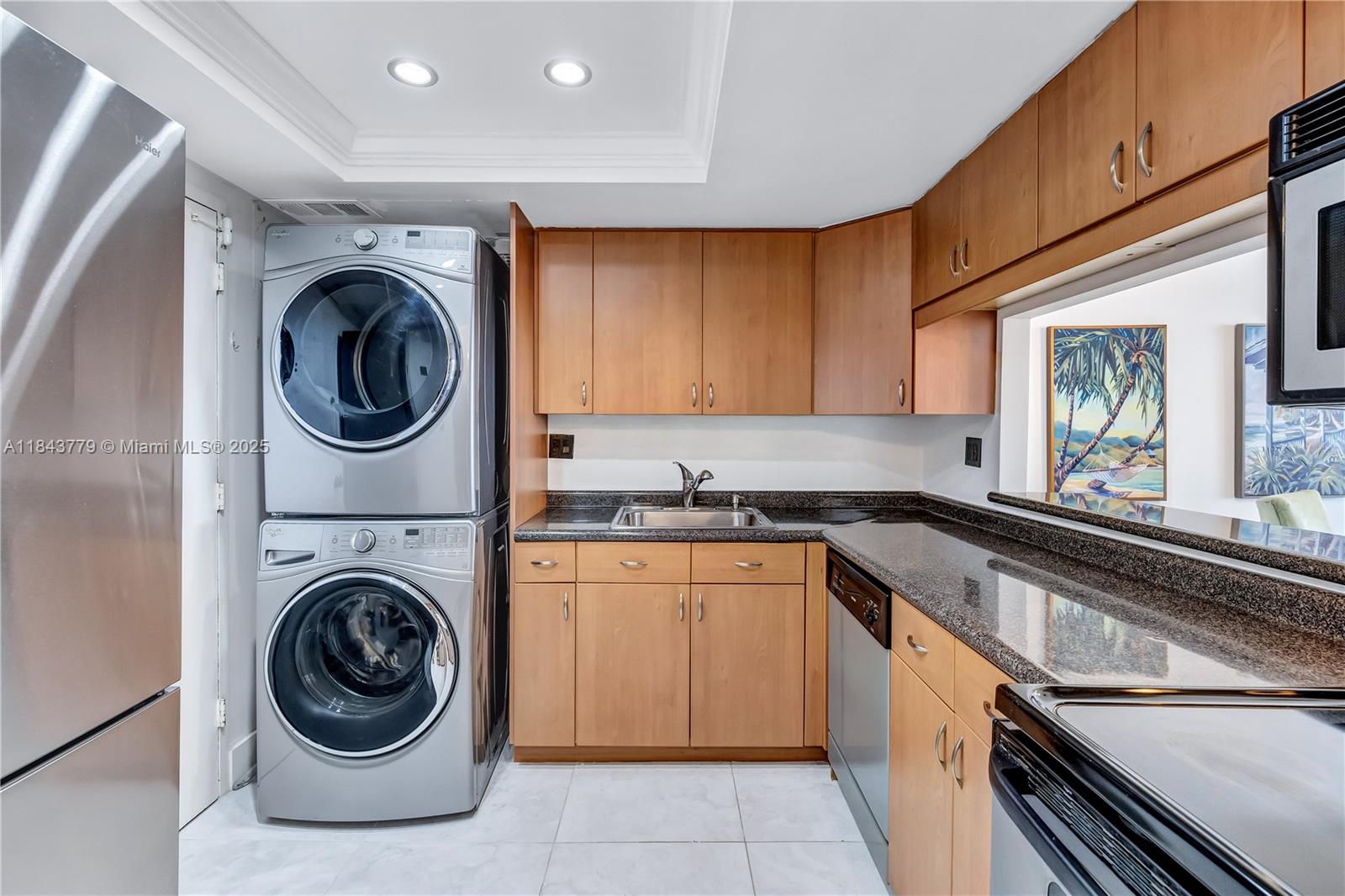 Photo of 3180 Ocean Dr  #217, Hallandale Beach, Florida, 33009 - Full size washer and dryer inside the unit.