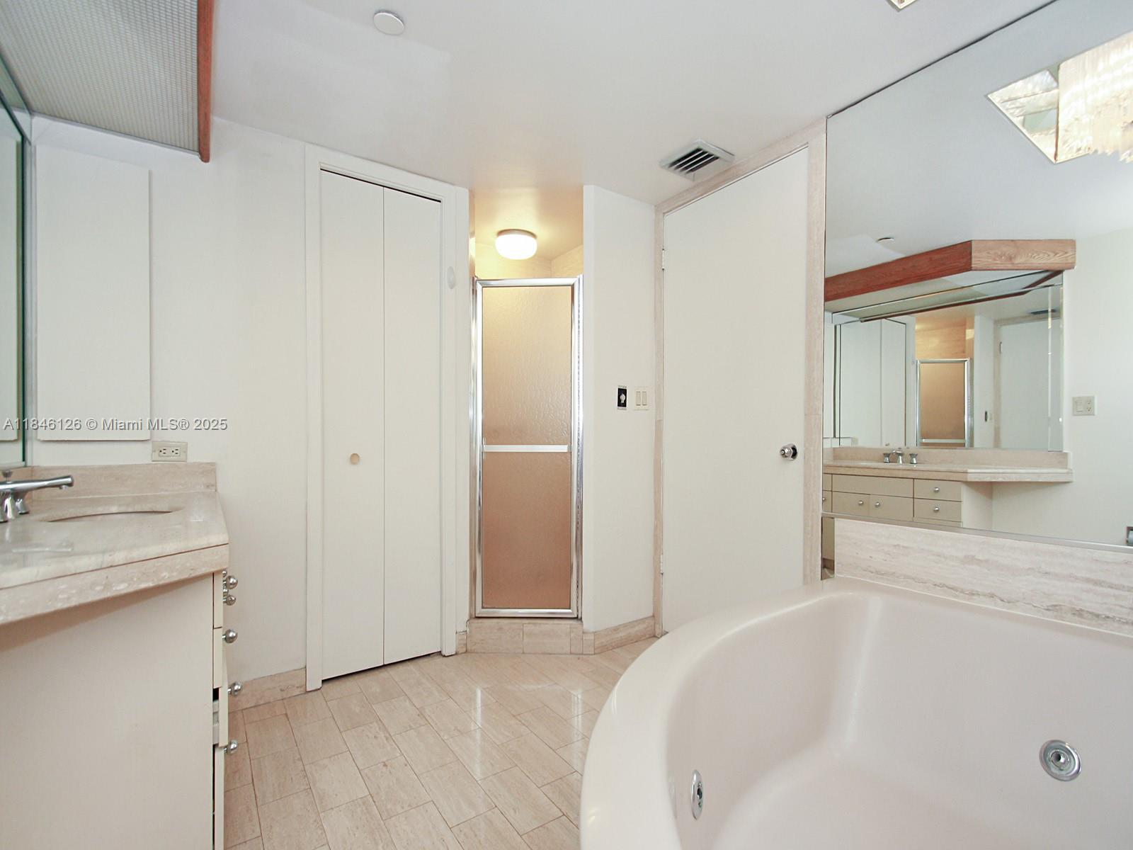 Photo of 19355 Turnberry Way  #12C, Aventura, Florida, 33180 - Master Bathroom with tub & shower