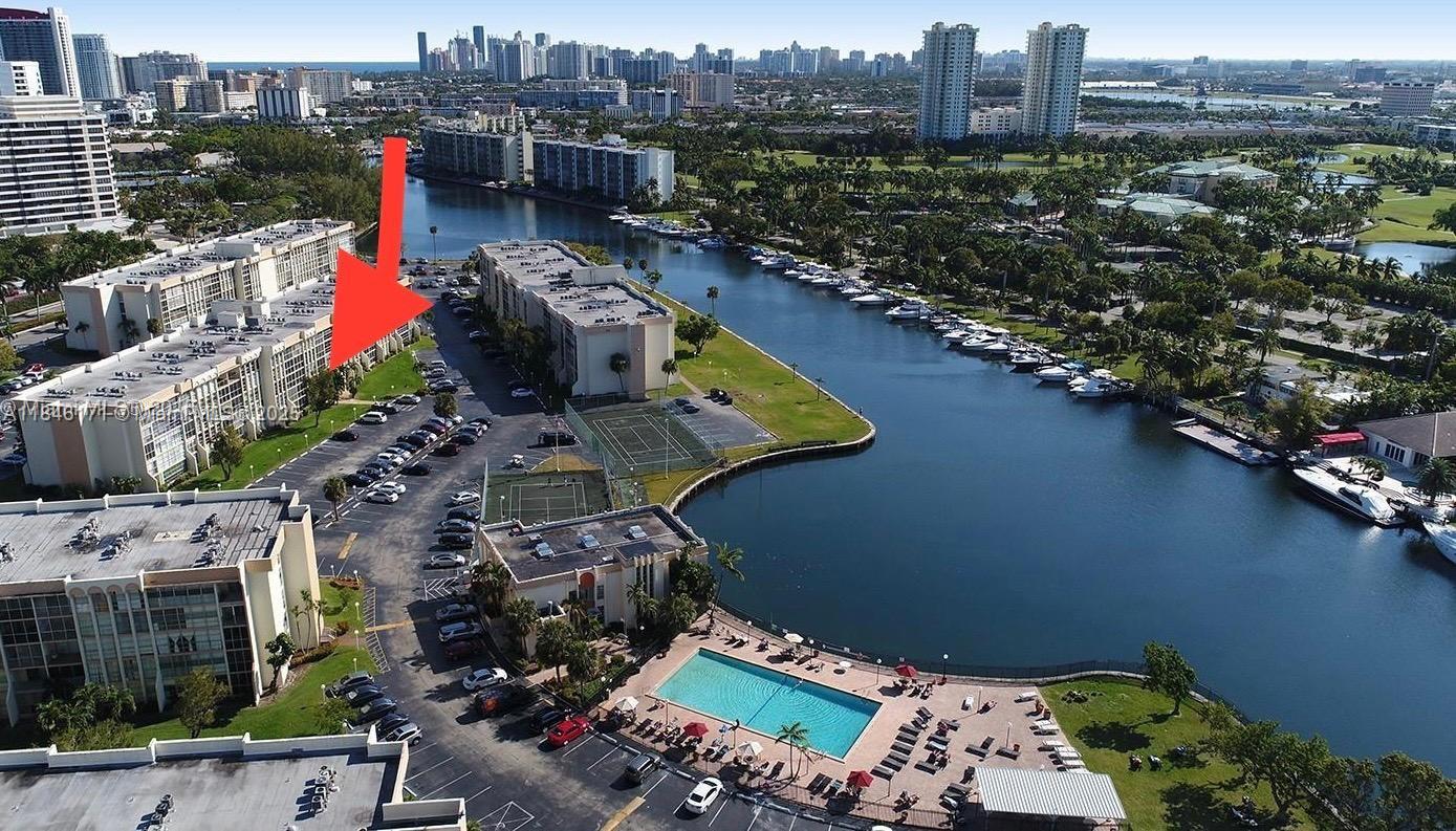 Photo of 701 Three Islands Blvd  #315, Hallandale Beach, Florida, 33009 - BUILDING AERIAL VIEW (Arrow shows the unit's balcony location)