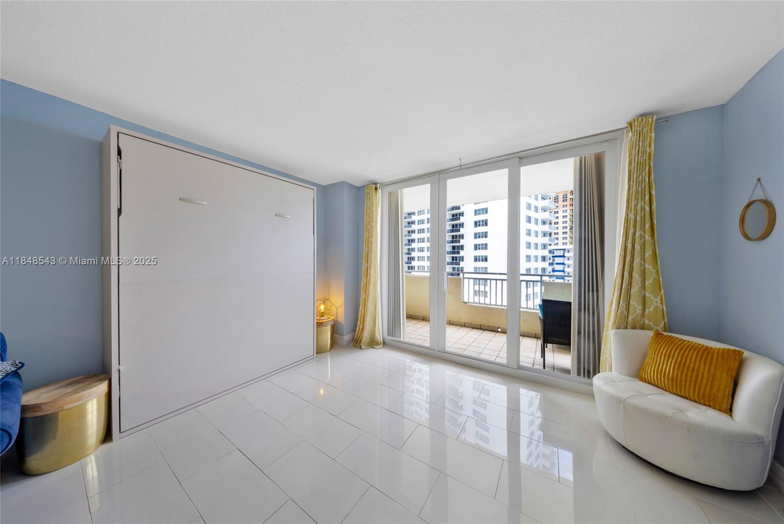 Photo of 3180 Ocean Dr  #607, Hallandale Beach, Florida, 33009 - Living room murphy bed area