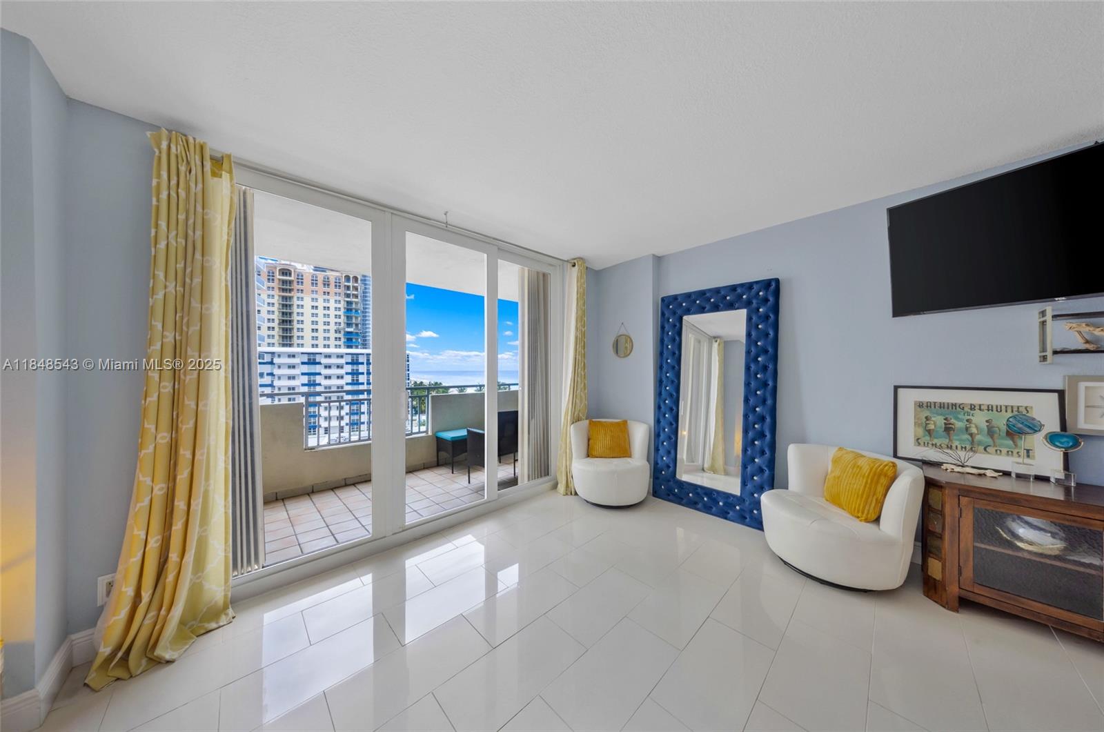 Photo of 3180 Ocean Dr  #607, Hallandale Beach, Florida, 33009 - Living room to balcony view
