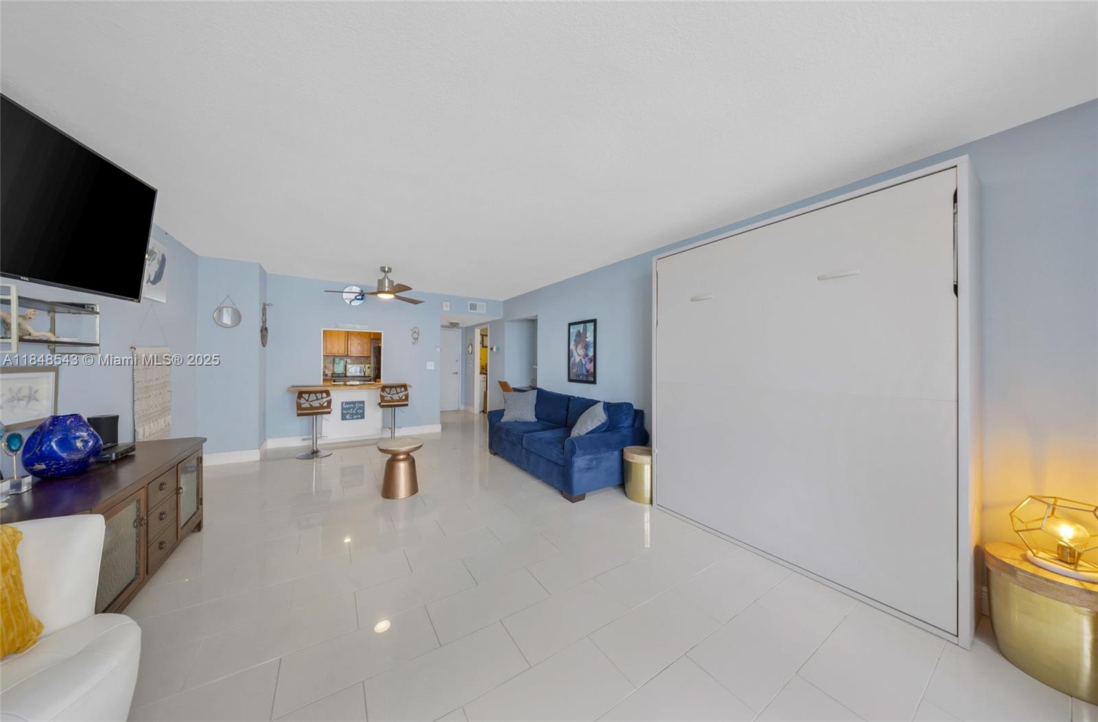 Photo of 3180 Ocean Dr  #607, Hallandale Beach, Florida, 33009 - Living room and murphy bed