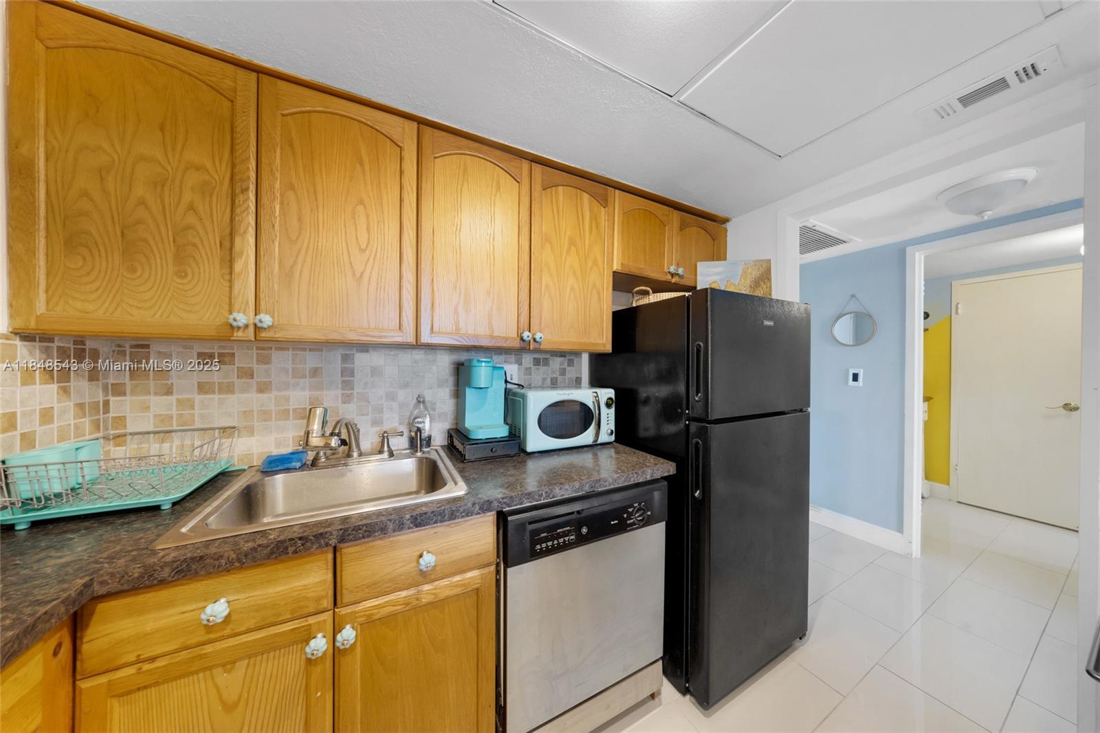 Photo of 3180 Ocean Dr  #607, Hallandale Beach, Florida, 33009 - Kitchen area stove and refrigerator
