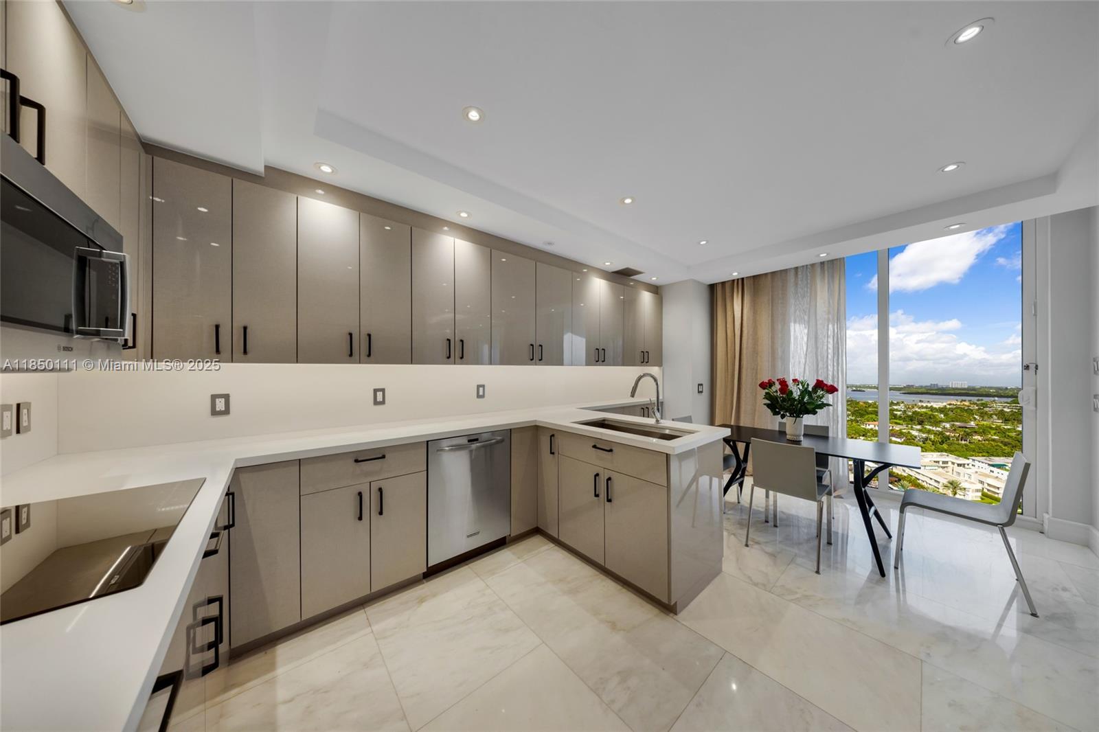 Photo of 9801 Collins Ave  #PH11 Great Renovation, Bal Harbour, Florida, 33154 - large chef's kitchen with breaksfast area