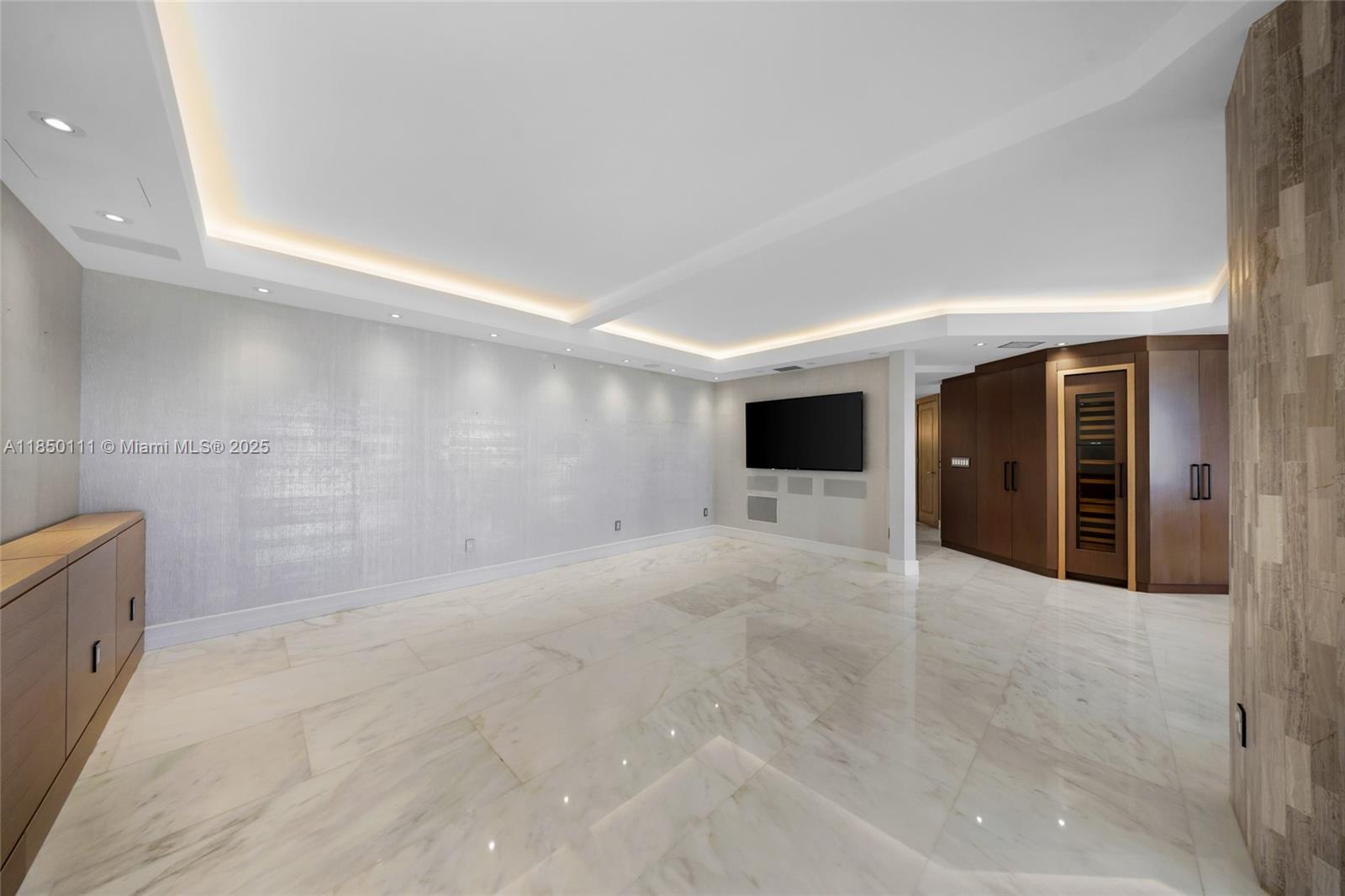 Photo of 9801 Collins Ave #PH11 Great Renovation, Bal Harbour, Florida, 33154 - Renovated with high ceilings, marble floors, and lighting, and large wine cooler