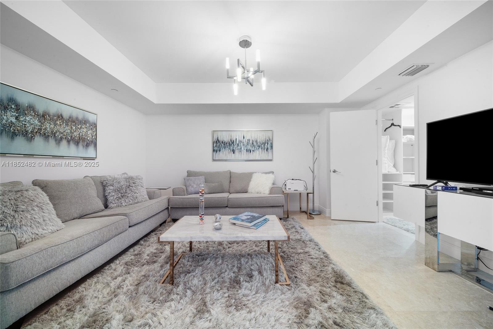 Photo of 20201 Country Club Dr  #1404, Aventura, Florida, 33180 - Can be used as a 3rd bedroom. One of the sofas is a sofa bed. Has a walk-in closet