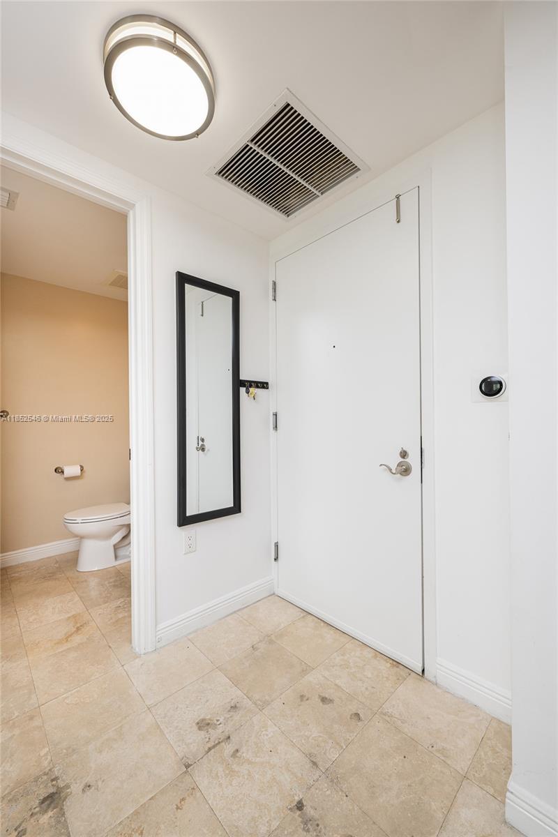 Photo of 1745 Hallandale Beach Blvd  #1804W, Hallandale Beach, Florida, 33009 - Entry/Guest Bathroom/Washer & Dryer
