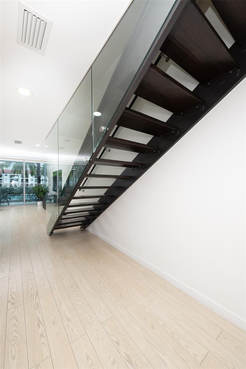 Photo of 2950 188th St  #139, Aventura, Florida, 33180 - Stairs/w custom made glass for safety.