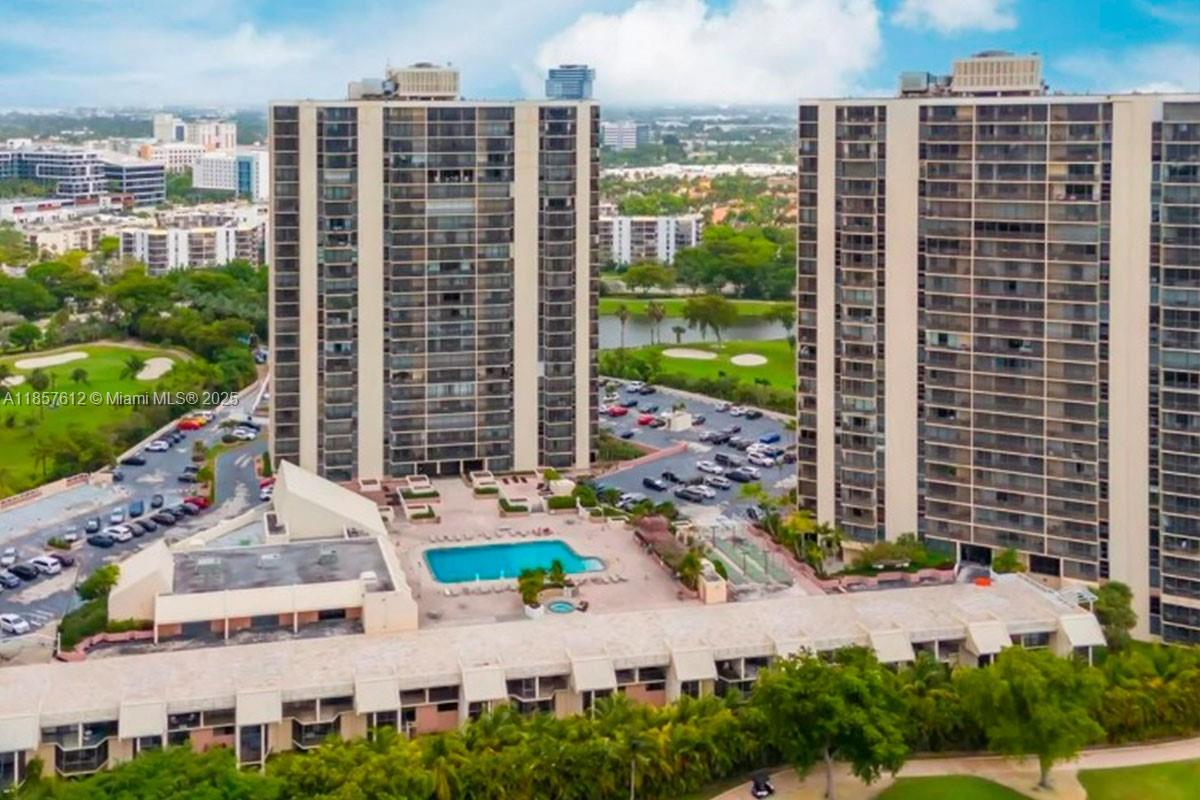Photo of 20335 Country Club Dr  #1808, Aventura, Florida, 33180 - Pool view and Gym  with Tower II and III in the back