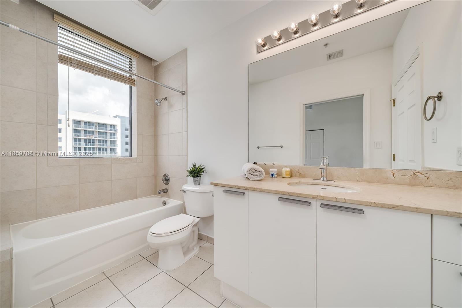 Photo of 140 Dixie Hwy  #1037, Hollywood, Florida, 33020 - 2nd bathroom with share door for 2nd and 3rd bedroom