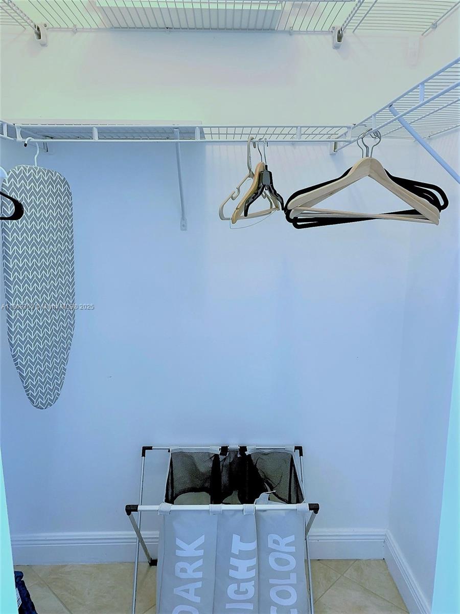 Photo of 2080 OCEAN DRIVE #PH3, Hallandale Beach, Florida, 33009 - Walk-in closet with lots of space for clothes