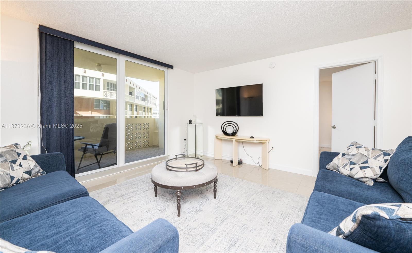 Photo of 1833 Ocean Dr  #1007, Hallandale Beach, Florida, 33009 - Tastefully Furnished Spacious Living Room/w Entrance to Open Balcony