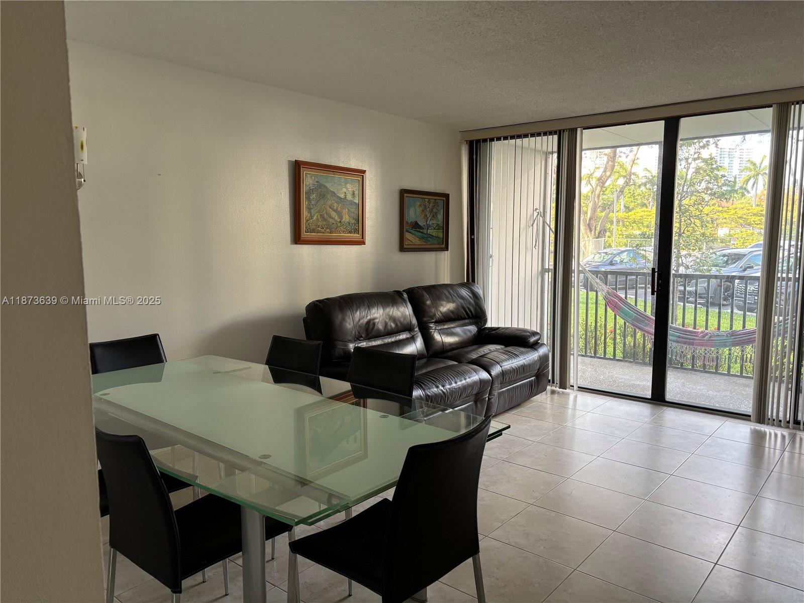 Photo of 3475 Country Club Dr  #116, Aventura, Florida, 33180 - DINING AND LIVING ROOM AREA