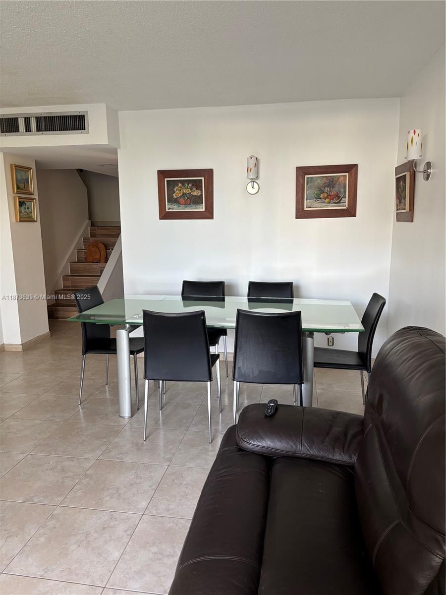 Photo of 3475 Country Club Dr  #116, Aventura, Florida, 33180 - DINING AND LIVING ROOM AREA