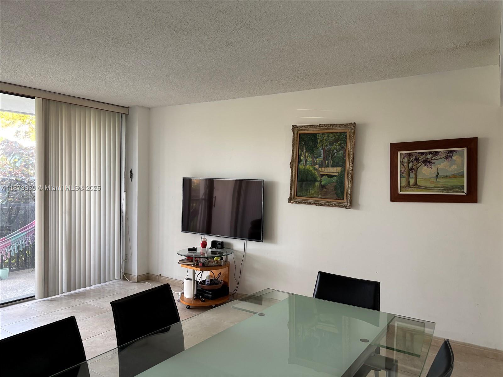 Photo of 3475 Country Club Dr  #116, Aventura, Florida, 33180 - DINING AND LIVING ROOM AREA