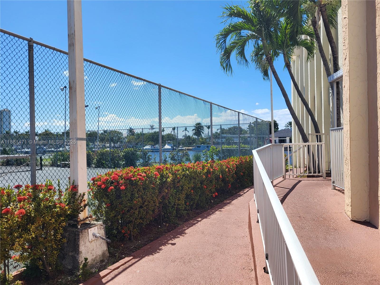 Photo of 601 Three Islands Blvd  #510, Hallandale Beach, Florida, 33009 - tennis court/clubhouse