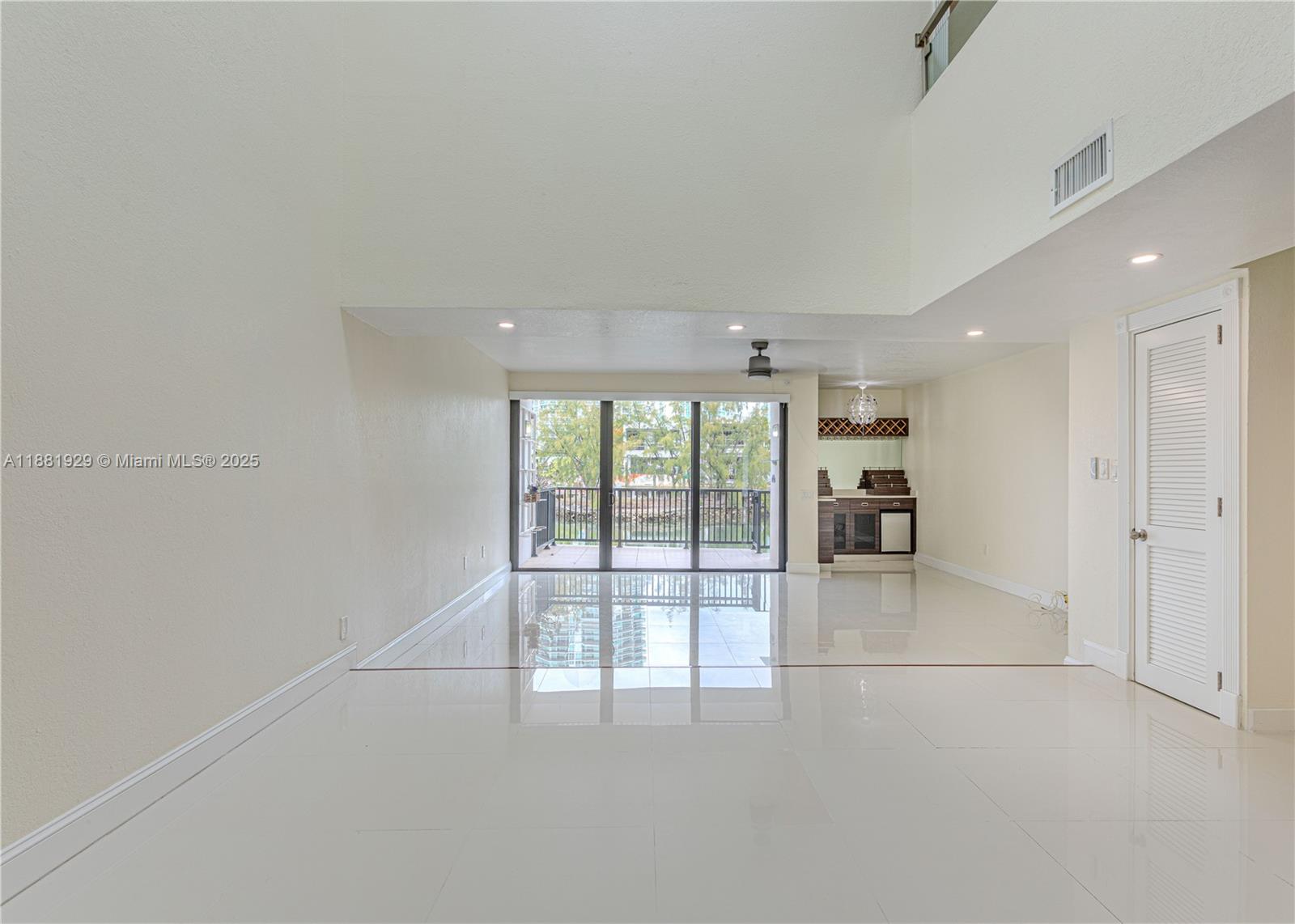 Photo of 231 Poinciana Dr  #401, Sunny Isles Beach, Florida, 33160 - and at the end the living area.