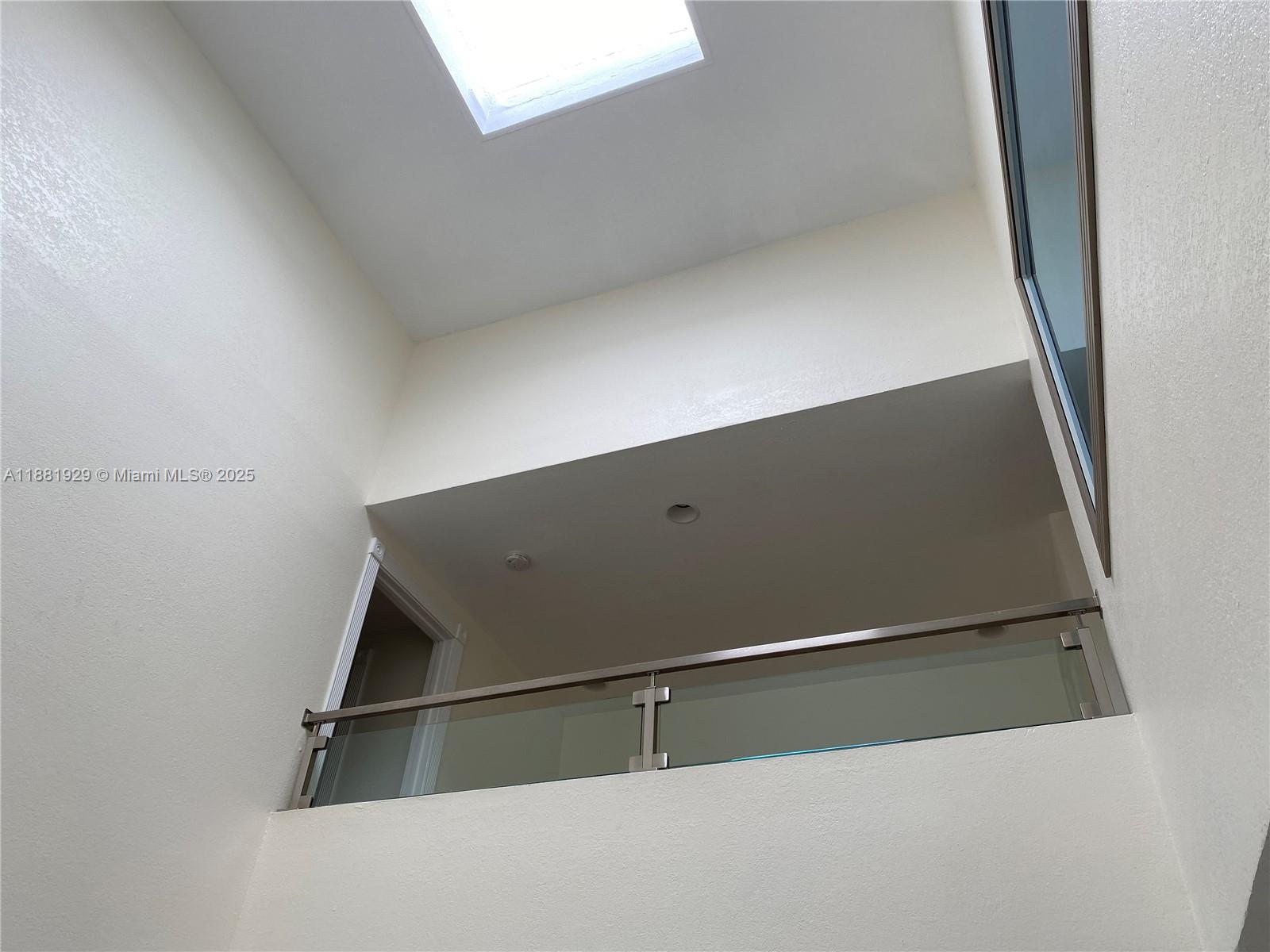 Photo of 231 Poinciana Dr  #401, Sunny Isles Beach, Florida, 33160 - Skylight seen from downstairs