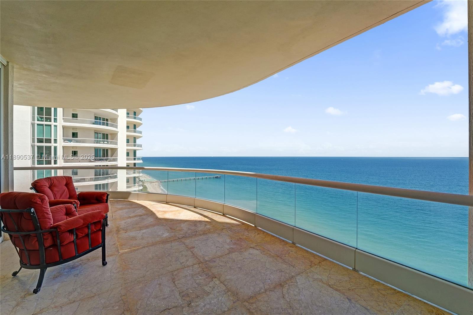 Photo of 16047 Collins Ave  #2101, Sunny Isles Beach, Florida, 33160 - What could be better than sitting on the huge wrap- around balcony and enjoy the fresh air and beautiful blue waters of the ocean ?!!!!