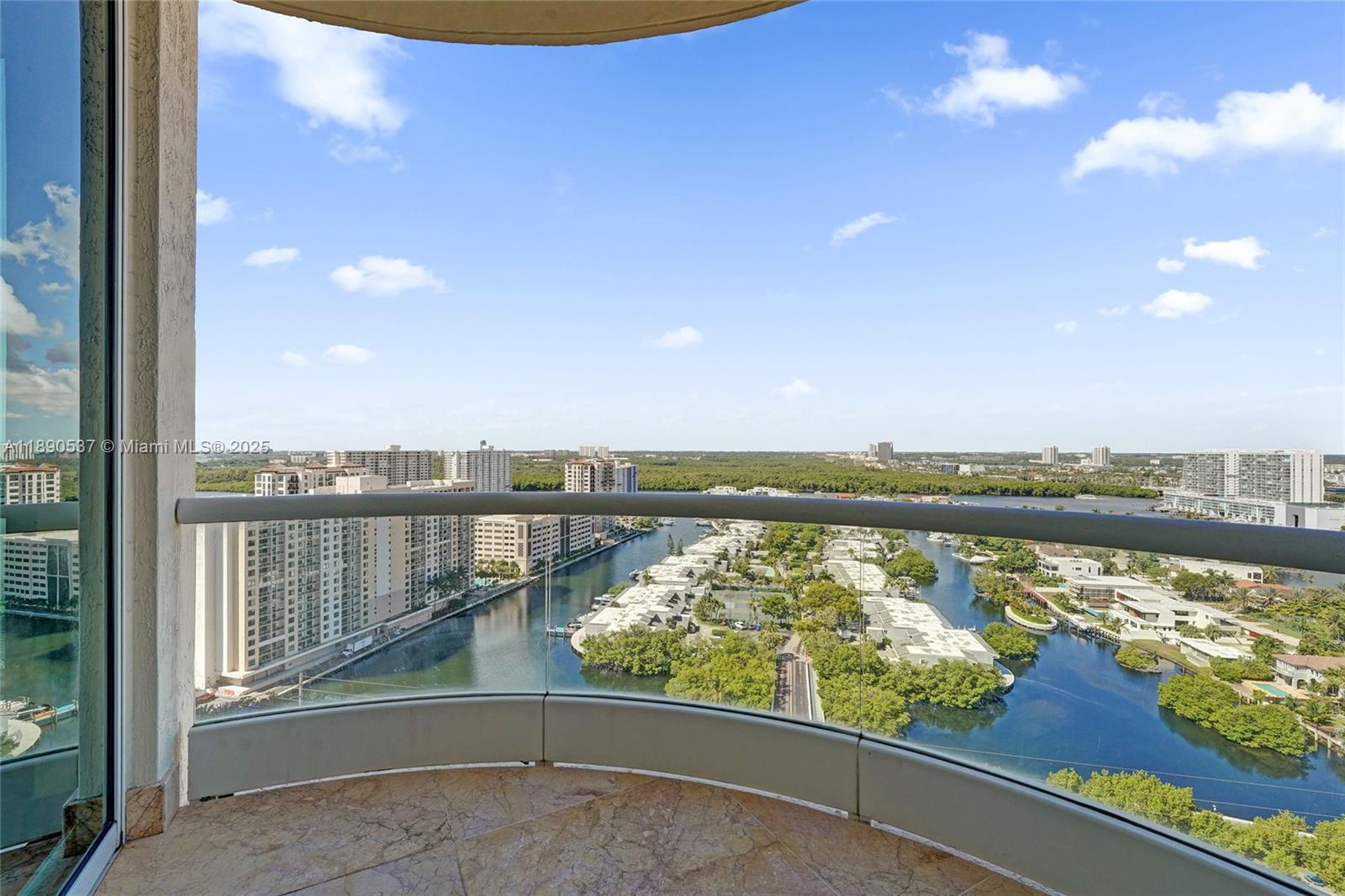 Photo of 16047 Collins Ave  #2101, Sunny Isles Beach, Florida, 33160 - Balcony off the bedroom on the west side overlooking the city and water......relax at the end of the day and enjoy the sunset!