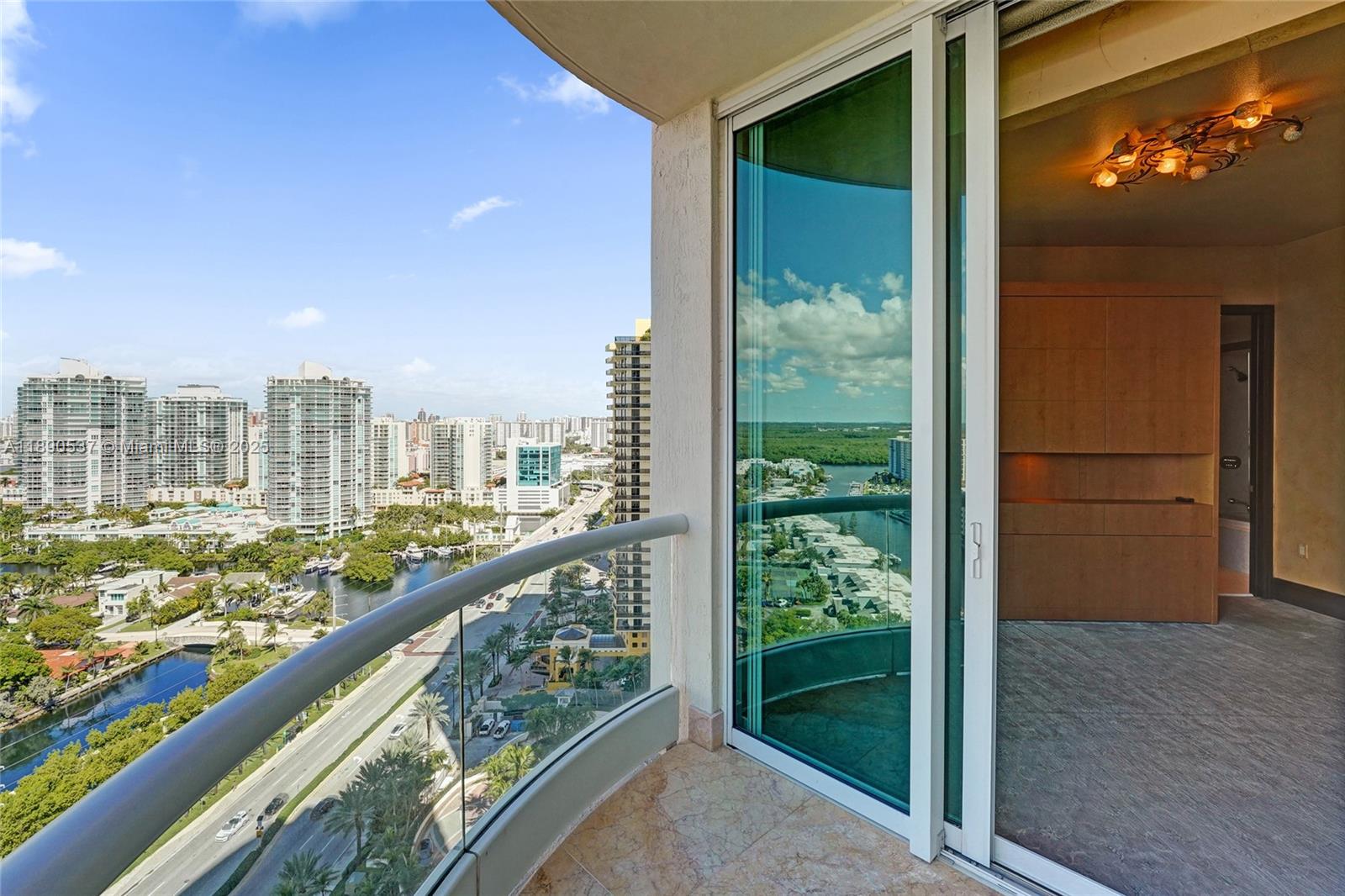 Photo of 16047 Collins Ave  #2101, Sunny Isles Beach, Florida, 33160 - Open the impact door for fresh air and enjoy the city and water views