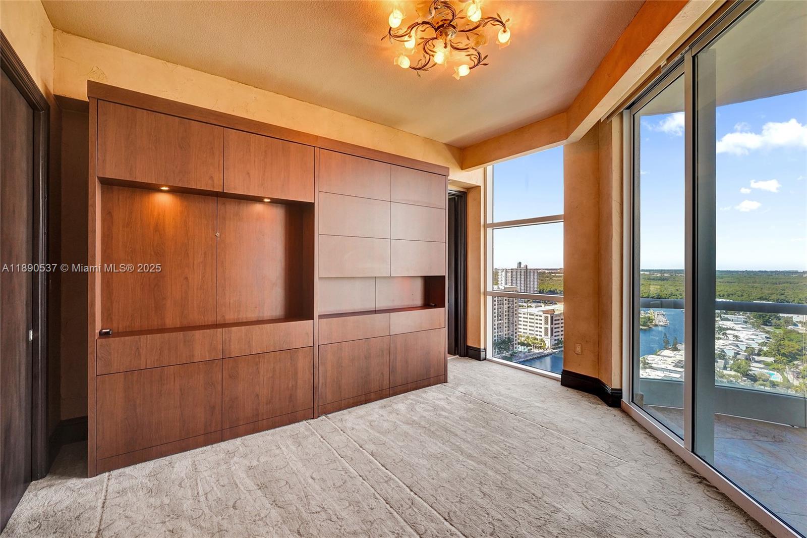Photo of 16047 Collins Ave  #2101, Sunny Isles Beach, Florida, 33160 - Bedroom with Murphy bed and built-ins......wake up to this gorgeous view of the city and water all around!