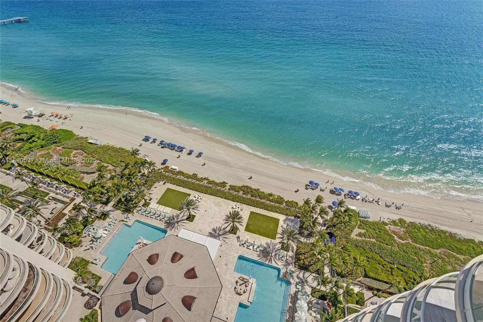 Photo of 16047 Collins Ave  #2101, Sunny Isles Beach, Florida, 33160 - Tower sits right on the sand of Sunny Isle Beach......walk downstairs directly to the beach!