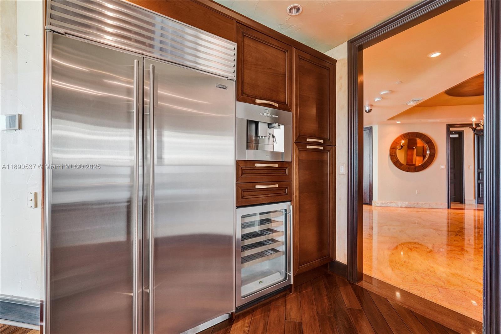 Photo of 16047 Collins Ave  #2101, Sunny Isles Beach, Florida, 33160 - Sub zero refrigerator, microwave and wine cooler all on one wall for your convenience!  Plus, lots of cabinetry!