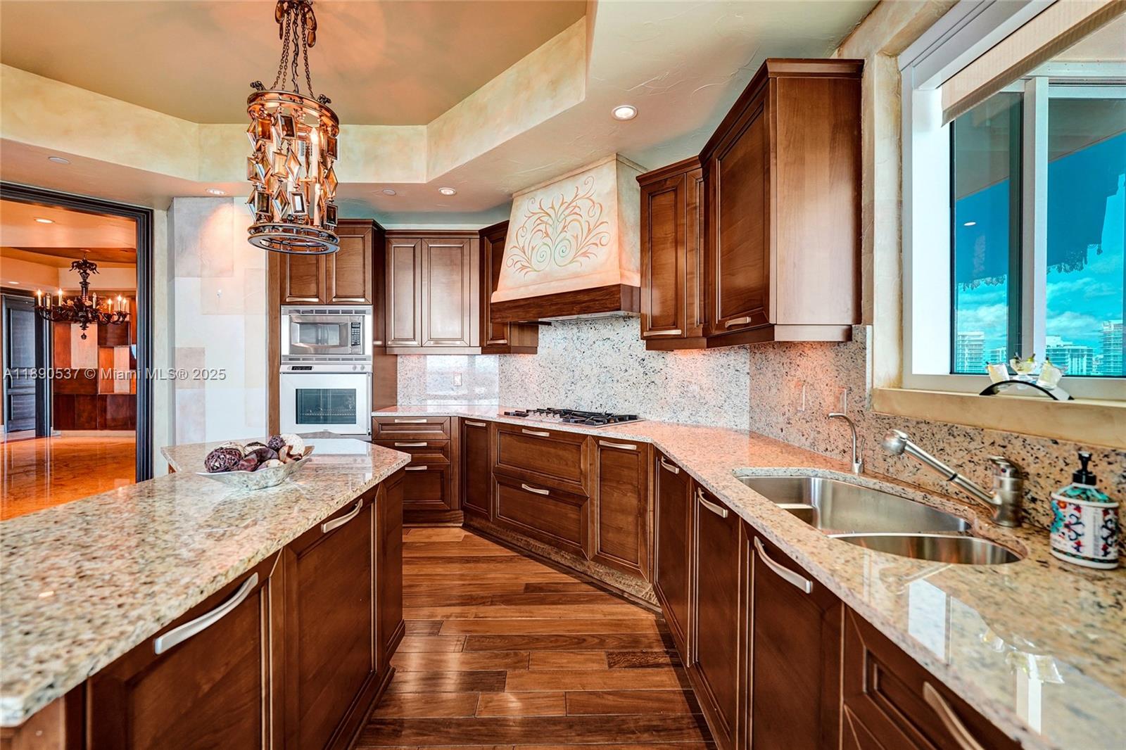 Photo of 16047 Collins Ave  #2101, Sunny Isles Beach, Florida, 33160 - Granite counters, double sink and lots of storage .....gorgeous wood floors too which complement the beautiful marble floors!