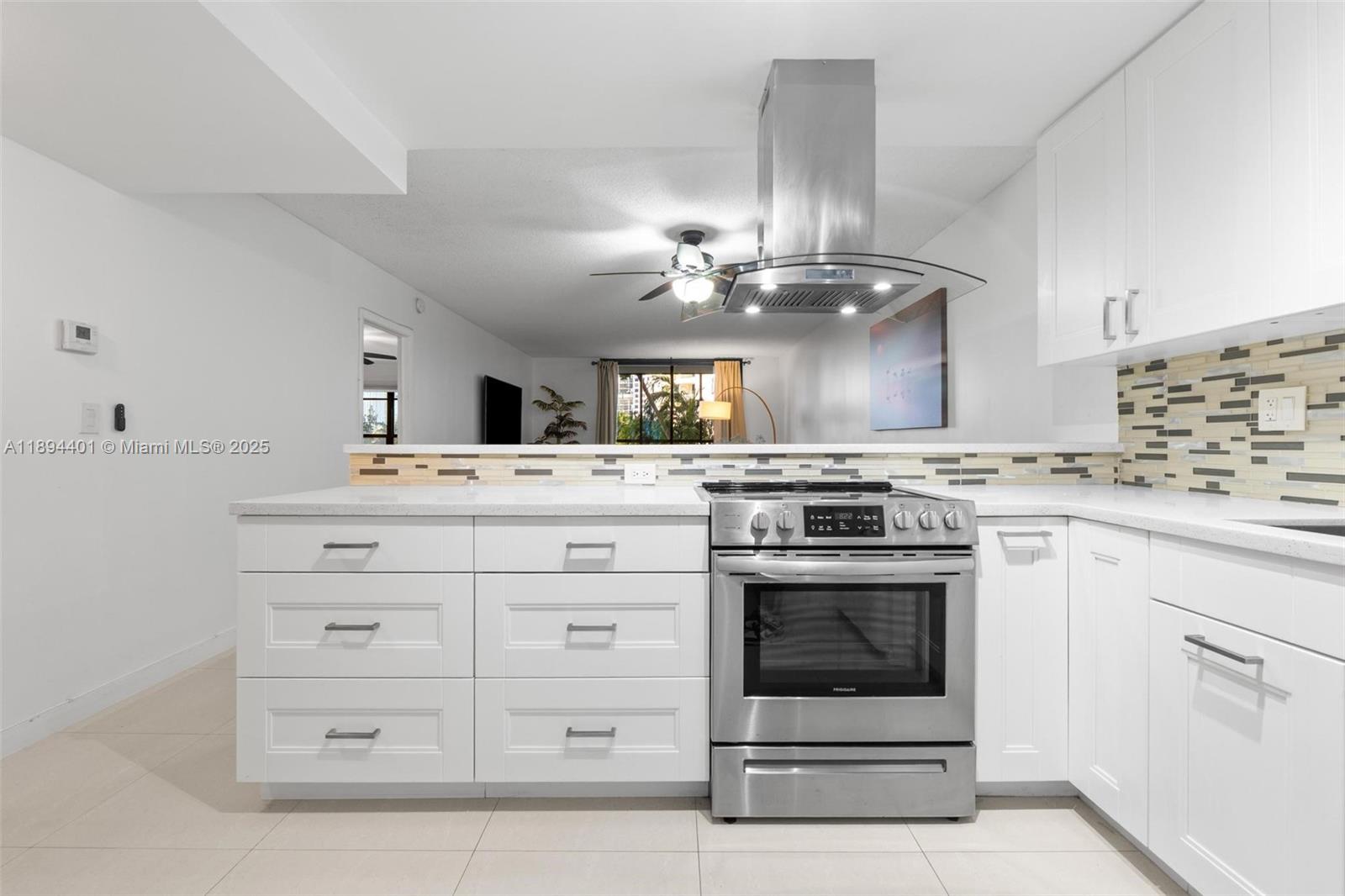 Photo of 600 Three Islands Blvd #317, Hallandale Beach, Florida, 33009 - Completely remodeled kitchen ovderlooking living area