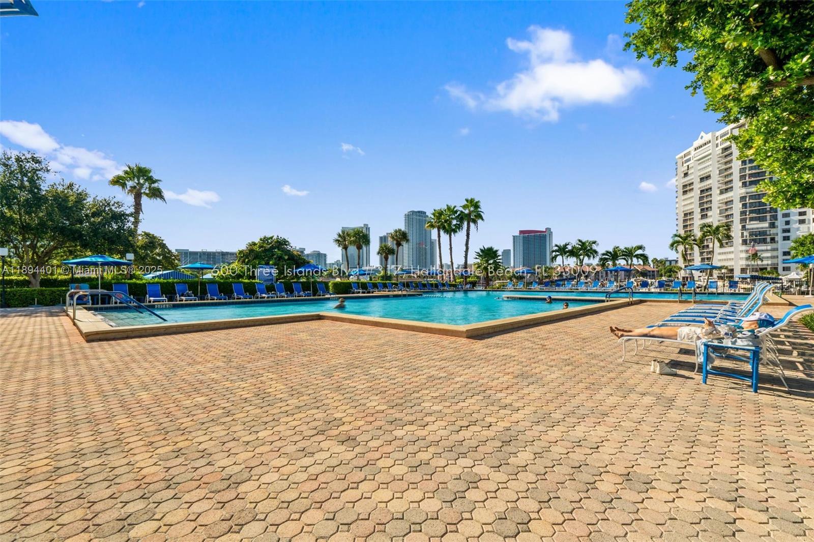 Photo of 600 Three Islands Blvd  #317, Hallandale Beach, Florida, 33009 - Expansive pool deck and lounging area