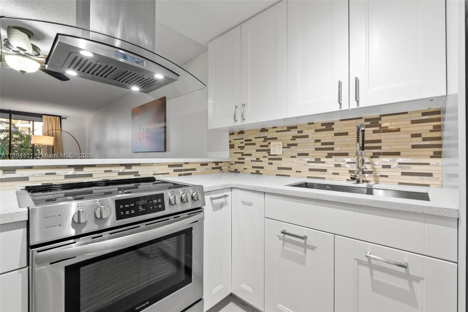 Photo of 600 Three Islands Blvd #317, Hallandale Beach, Florida, 33009 - Updated cabinetry & appliances, quartz countertops. Fully-equipped kitchen including dining plates, cutlery & glassware