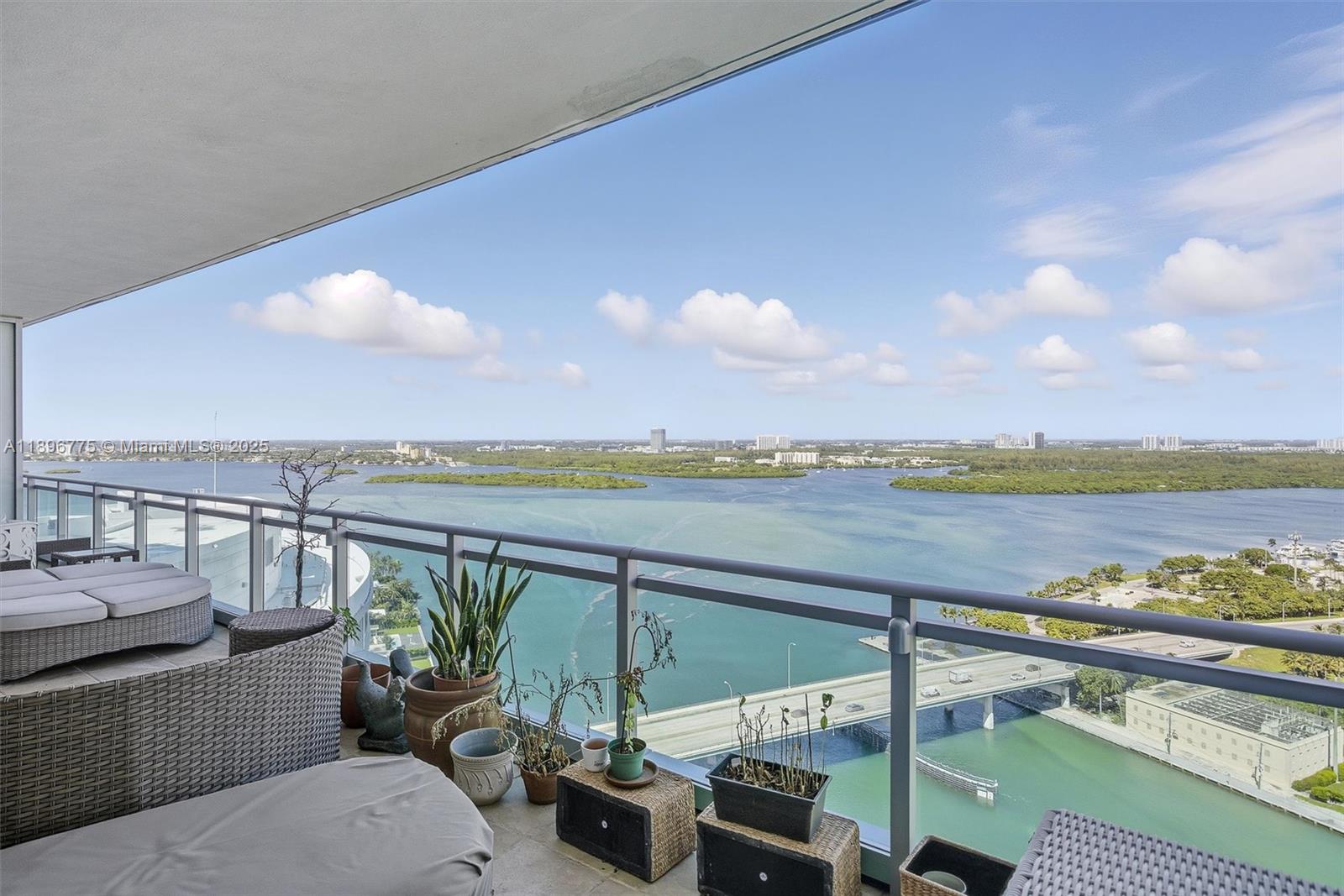 Photo of 10295 Collins Ave  #2207, Bal Harbour, Florida, 33154 - Balcony 2 with NW view overlooking Haulover Sandbar with open view to the guitar-shaped Seminole Hard Rock Hotel & Casino