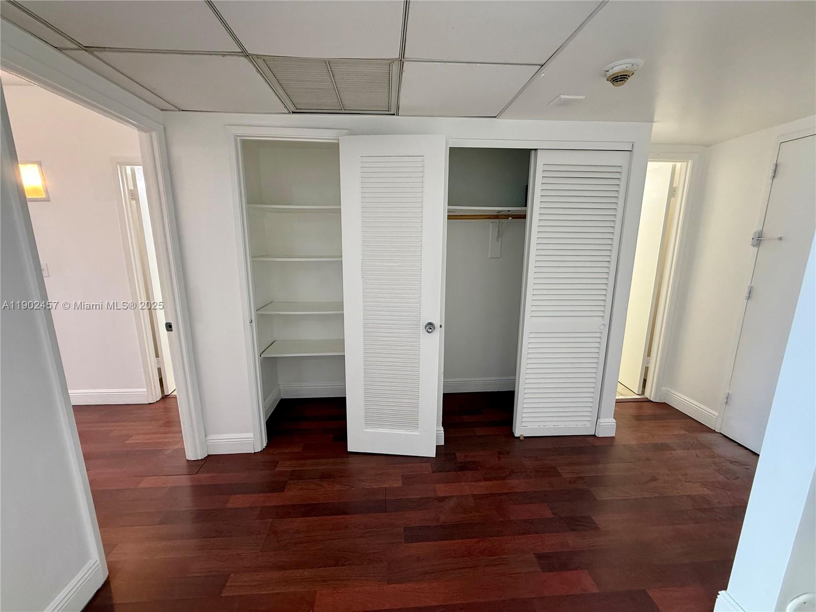 Photo of 19390 Collins Ave  #1423, Sunny Isles Beach, Florida, 33160 - Bedroom entrance on left, pantry and closet, half bathroom and apartment entrance on right.