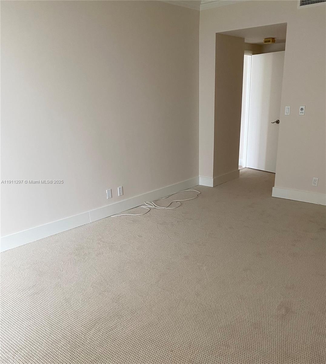Photo of 20281 Country Club Dr  #511, Aventura, Florida, 33180 - Carpet in the bedrooms.