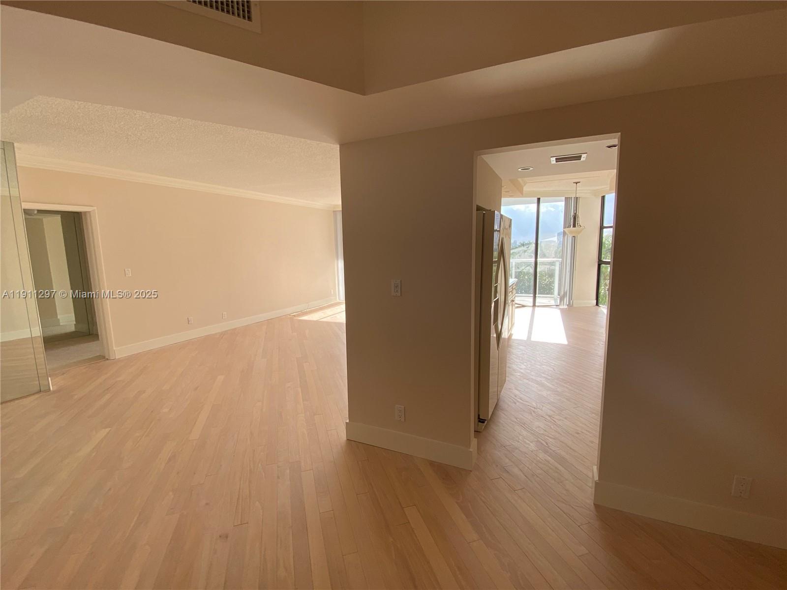 Photo of 20281 Country Club Dr  #511, Aventura, Florida, 33180 - Beautiful woood floors in the spacious living area.