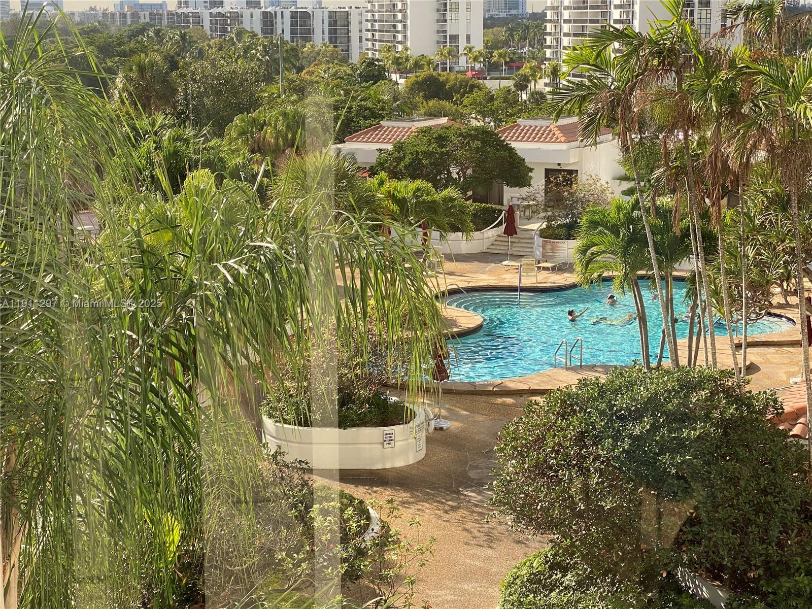Photo of 20281 Country Club Dr  #511, Aventura, Florida, 33180 - View of the pool from the balcony.