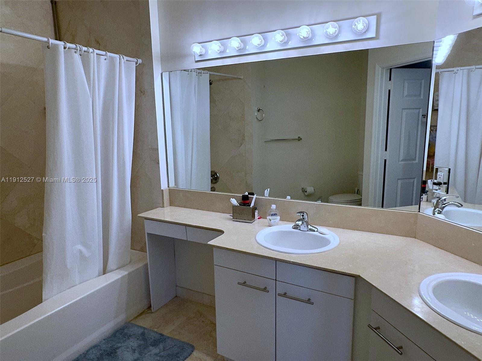 Photo of 2080 Ocean Dr #112, Hallandale Beach, Florida, 33009 - with 2 sinks, shower/tub combo