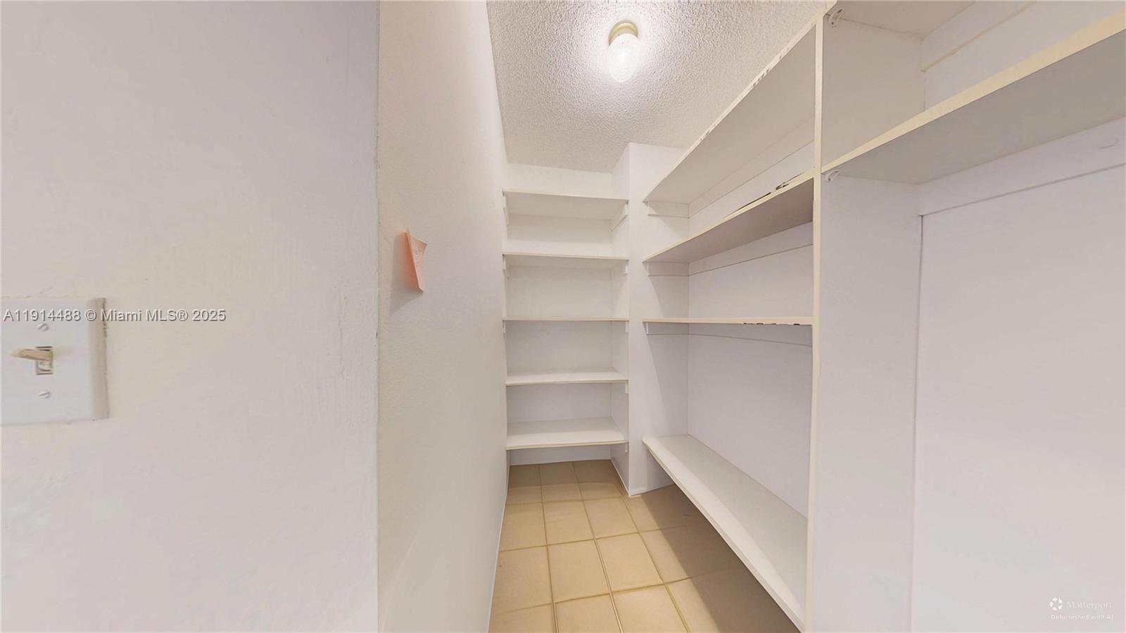 Photo of 600 THREE ISLANDS BLVD  #402, Hallandale Beach, Florida, 33009 - SECOND BEDROOM HALLWAY CLOSET
