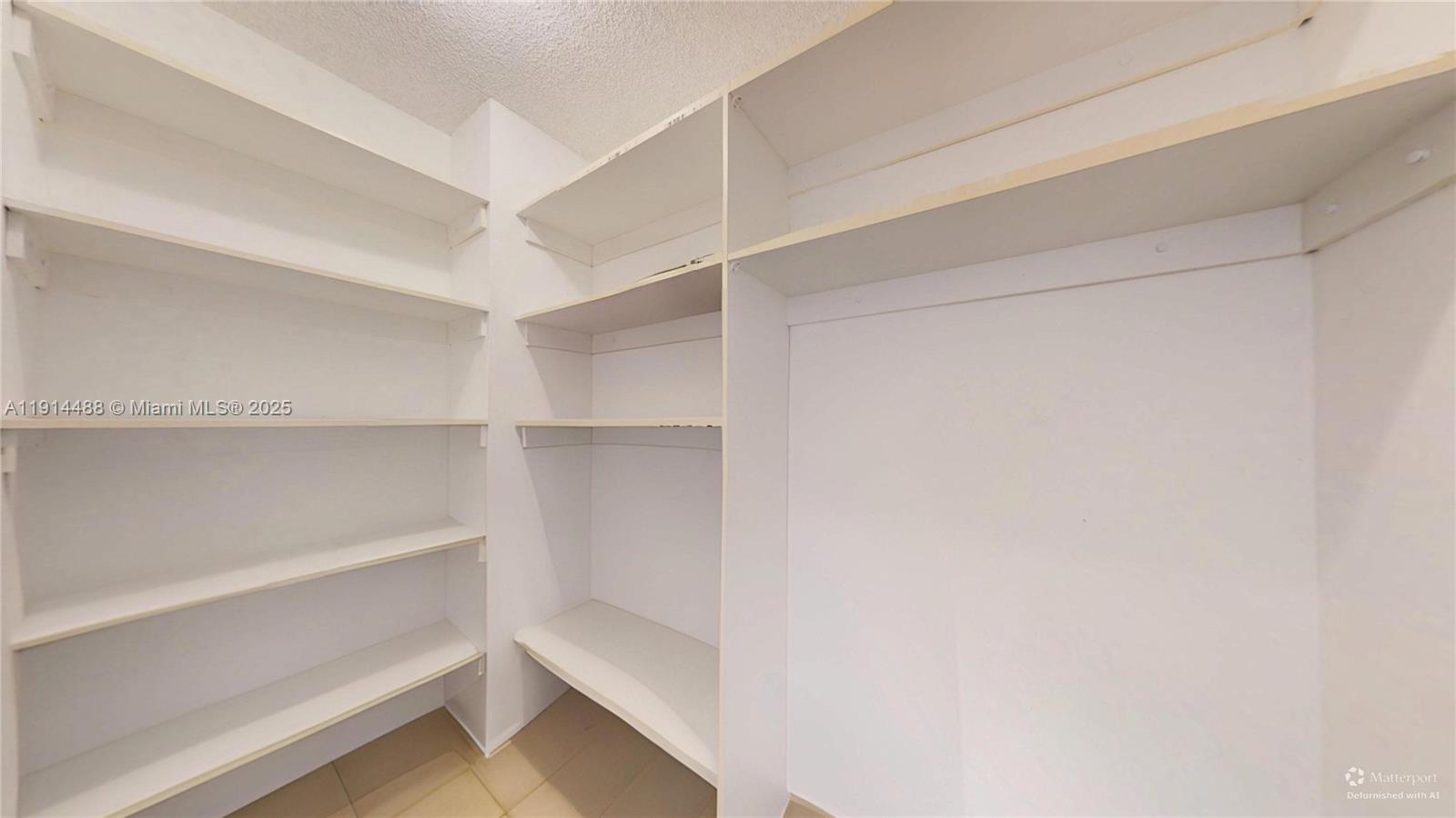 Photo of 600 THREE ISLANDS BLVD  #402, Hallandale Beach, Florida, 33009 - SECOND BEDROOM HALLWAY CLOSET