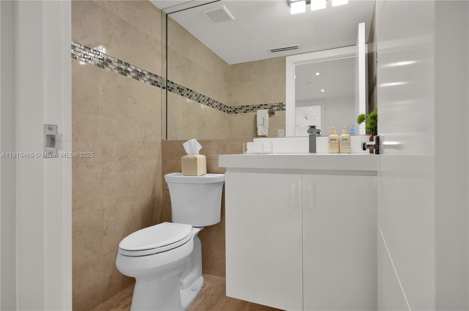 Photo of 10175 Collins Ave  #504, Bal Harbour, Florida, 33154 - Powder room in foyer