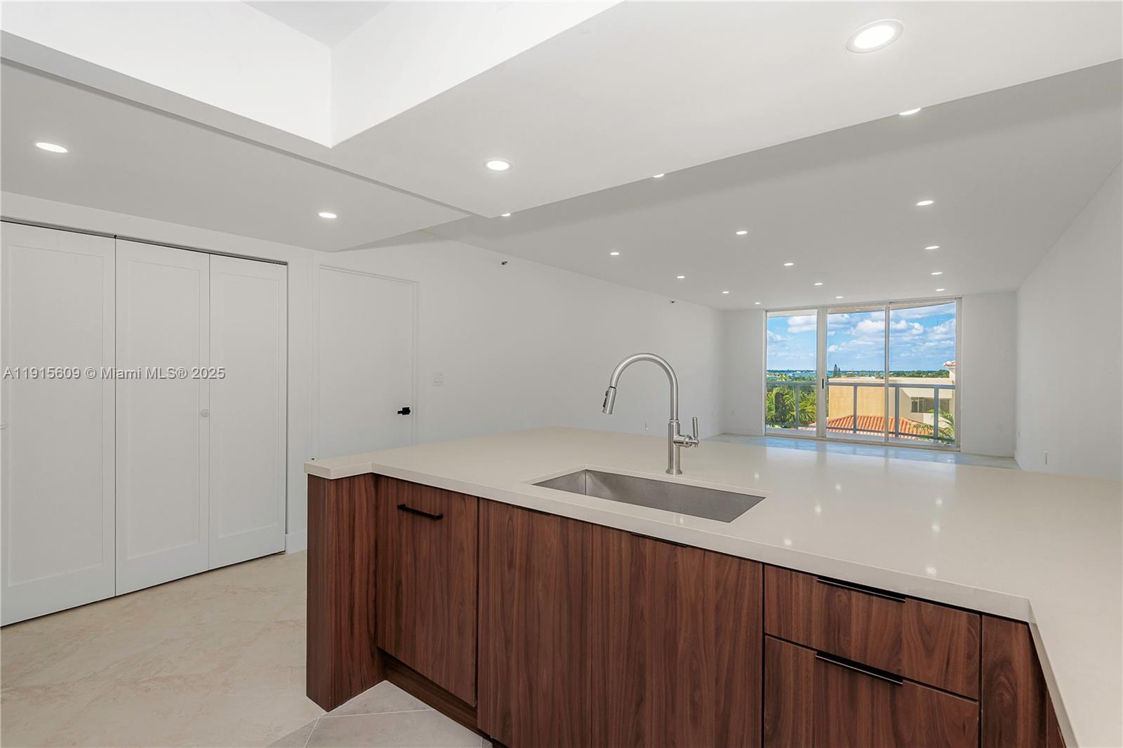 Photo of 8855 Collins Ave  #6E, Surfside, Florida, 33154 - open kitchen next to large double closet/pantry