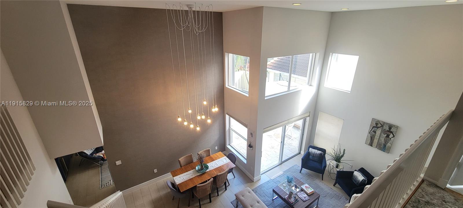 Photo of 1055 Yellow Birch Ter  (1055), Hollywood, Florida, 33019 - Two story ceiling living and dining room