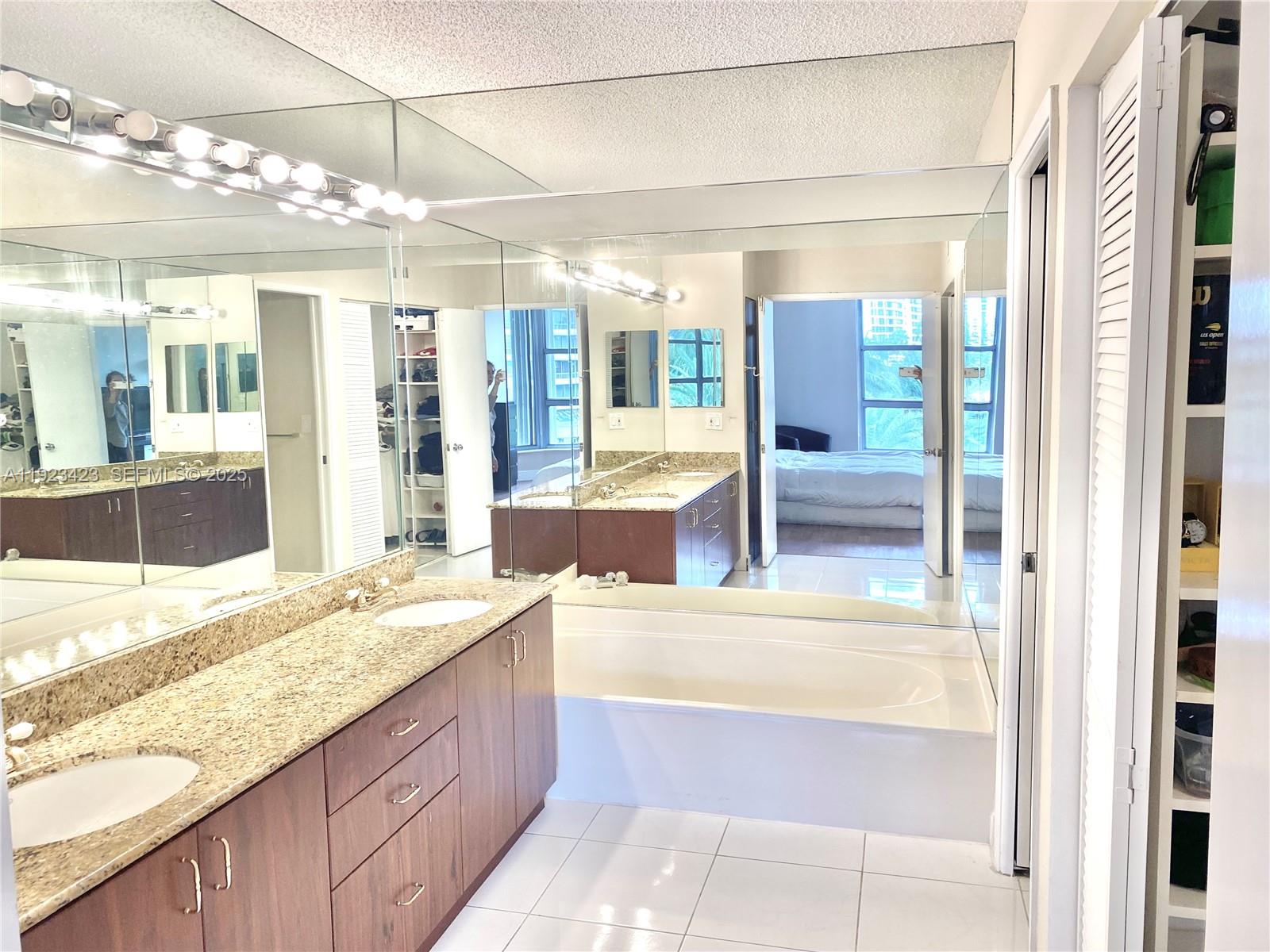 Photo of 19195 36th Ct #402, Aventura, Florida, 33180 - double sink countertop and separate bathtub