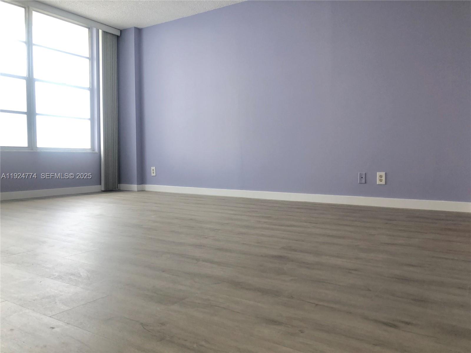 Photo of 3800 Ocean Dr #922, Hollywood, Florida, 33019 - Bedroom with new laminate flooring.